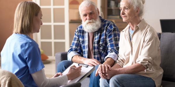Photo of patient listening to doctor